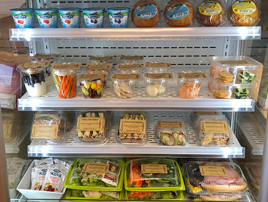 micro market refrigerator, which is a self-service retail setup designed for workplaces or public spaces.