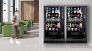 2 vending machines by the wall beside the breakroom